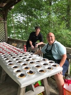 Glimmerglass volunteers guard the dessert table.