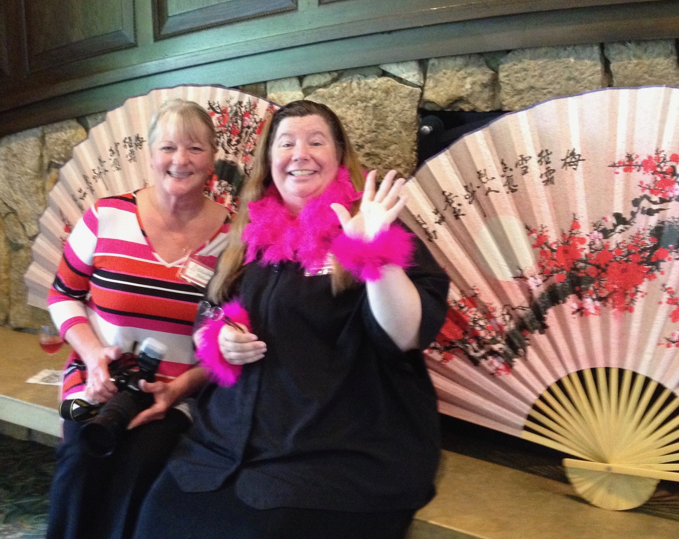 Pretty in Pink is the theme for the Twin Cities Fundraiser - two attendees get in the spirit.
